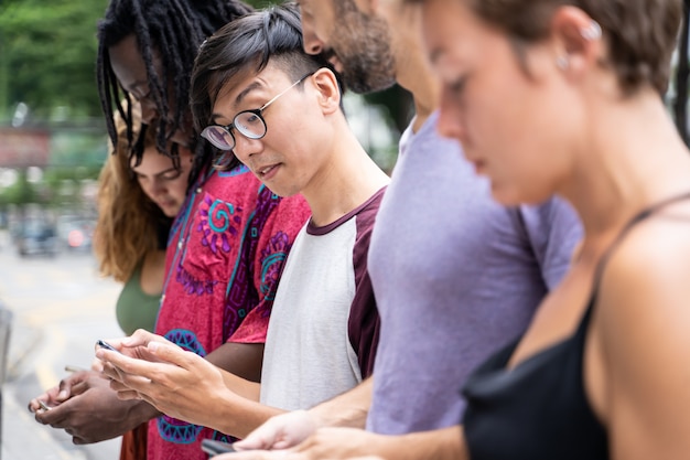 Group of young people of different ethnicities with a mobile phone