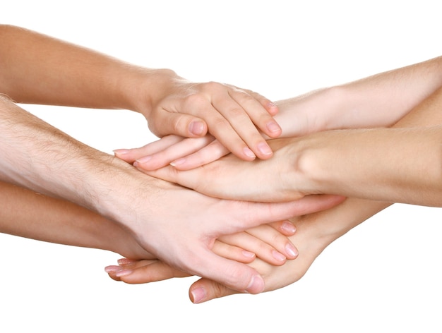 Group of young people's hands isolated on white