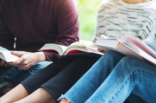 Group of young people sitting and enjoyed reading books together