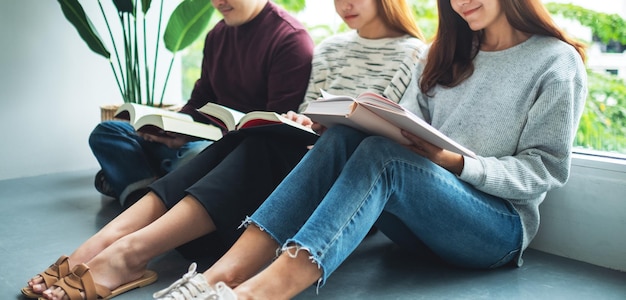 Group of young people sitting and enjoyed reading books together