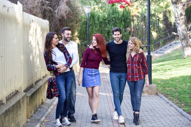 Group of young people together outdoors in urban background