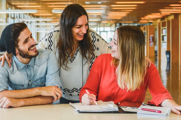 Group of young students studying together.