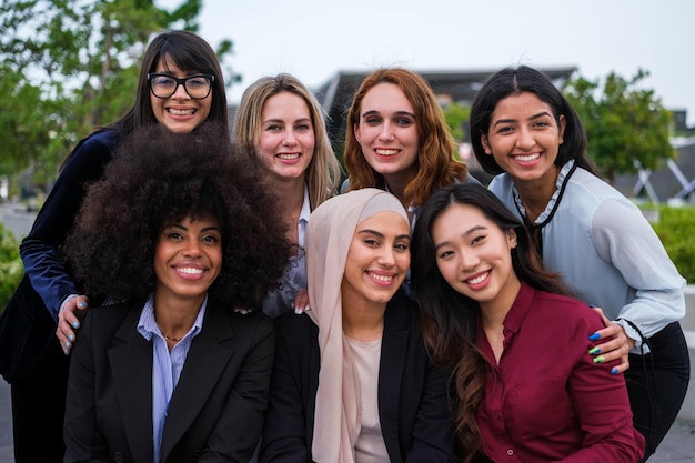 Group of young women resting together in financial district focus on standing girls