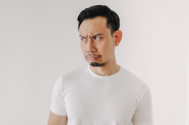 Grumpy face man in white tshirt isolated on white background