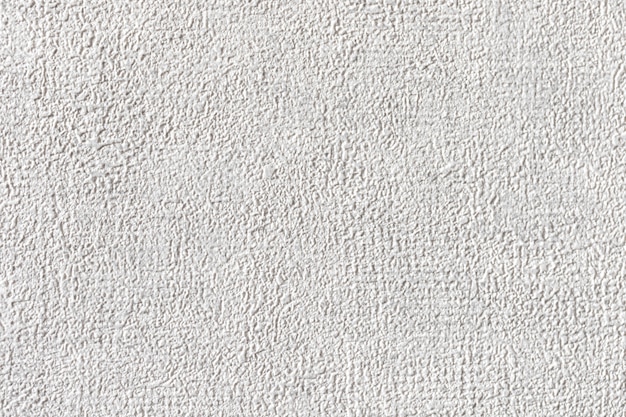 Grunge white texture background, rough white surface close-up photo