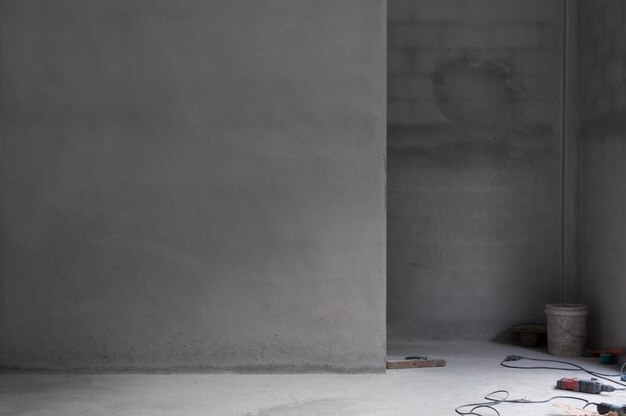 Grungy concrete wall and stone floor room and tool as background,Abstract architecture background