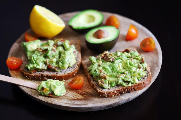 Guacamole sandwiches on a wooden board Keto diet food