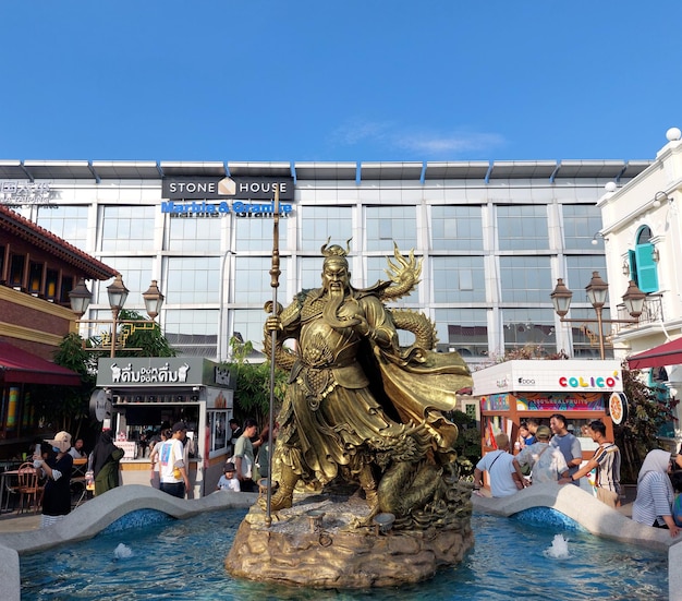 Guan Sheng Di Jun or Guan Yu god of war Statue made of golds at the fountain pond at Chinatown