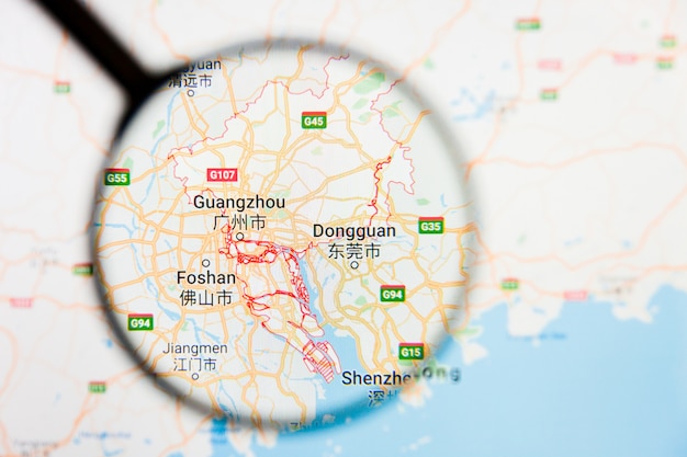 Guangzhou, China city visualization illustrative concept on display screen through magnifying glass