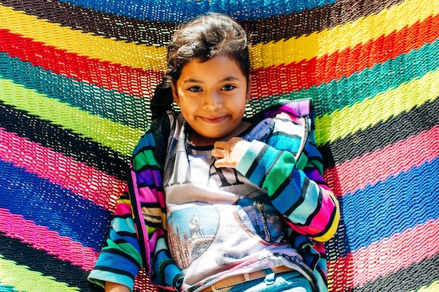 Guatemala 2018 portrait of the Guatemalan girl lies in a colorful hammock