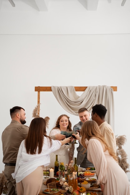 Guests attending wedding and eating at the table