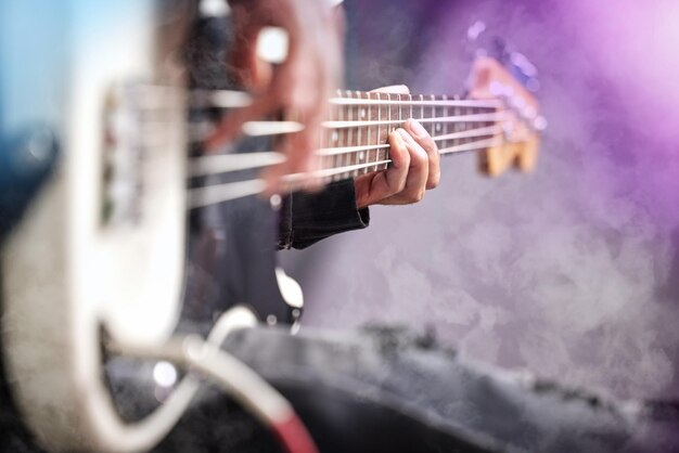 Guitar smoke and man hands at music festival show playing rock with electric instrument with mockup Sound musician and party with live talent and audio for punk event with people at a concert