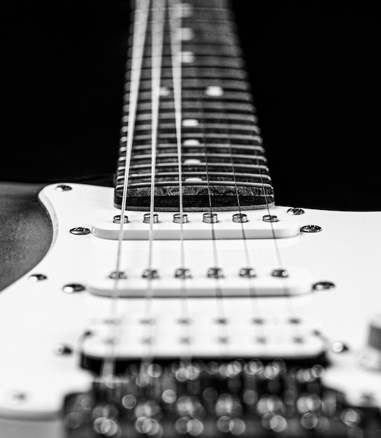 Guitar strings close up Electric Bass Guitars Electric guitar Close up of music guitar Stringed electric musical instrument Black and white