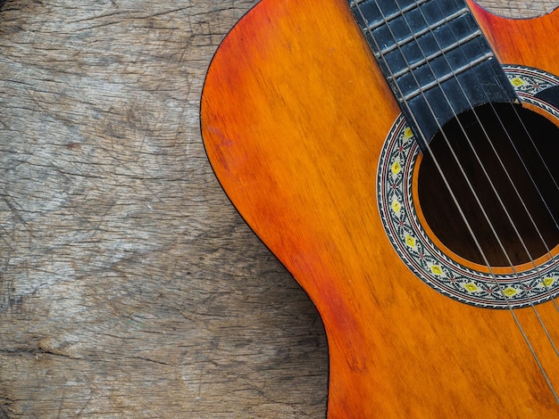 The guitar on wooden texture background. Love, Music day concept.