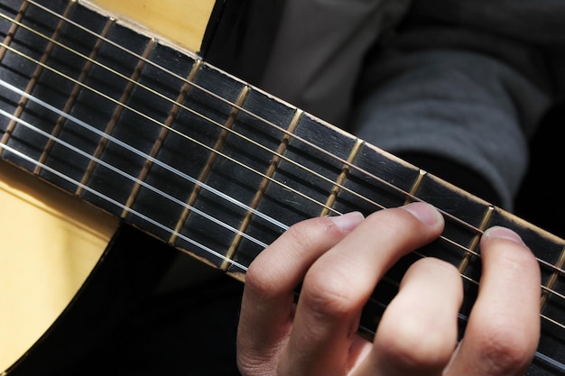 guitarist playing acoustic guitar