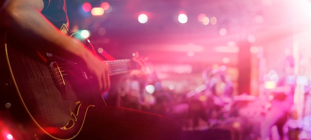 Guitarist on stage for background, soft and blur concept