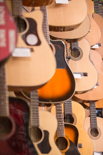 Guitars is hanging on wall of music studio.