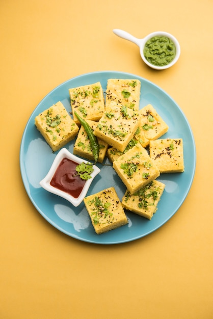 Gujarati Khaman Dhokla made using Chana Dal, served with Green chutney, selective focus