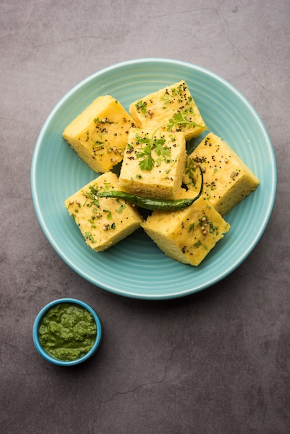 Gujarati Khaman Dhokla made using Chana Dal, served with Green chutney, selective focus