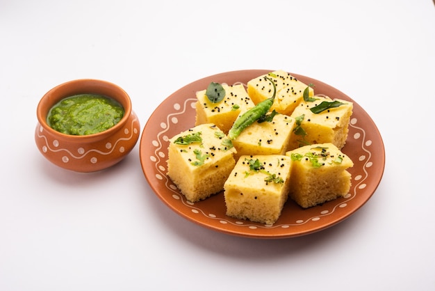 Gujarati Khaman Dhokla made using Chana Dal, served with Green chutney, selective focus