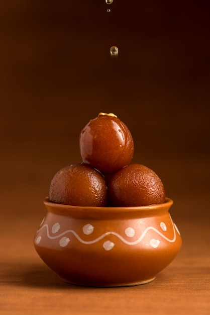 Gulab Jamun in clay pot. Indian Dessert or Sweet Dish