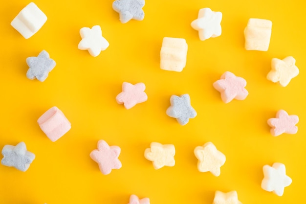 Gummy candies on yellow background Top view Jelly sweets