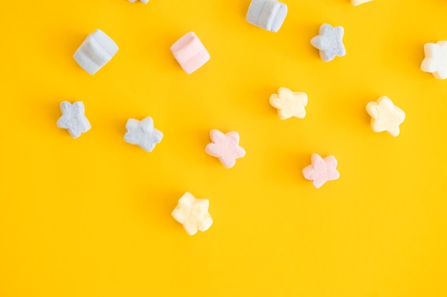 Gummy candies on yellow background Top view Jelly sweets