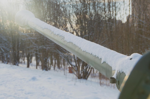 The gun barrel looks to the Sunny sky.