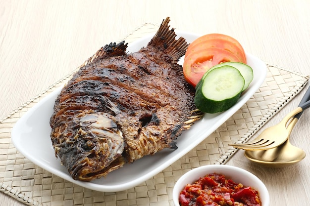 Gurame Bakar Madu Grilled Gourami with honey and soy sauce Served with sambal chilli sauce