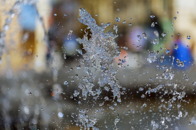 The gush of water of a fountain. Splash of water in the fountain