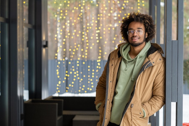 Guy in coat standing outdoors