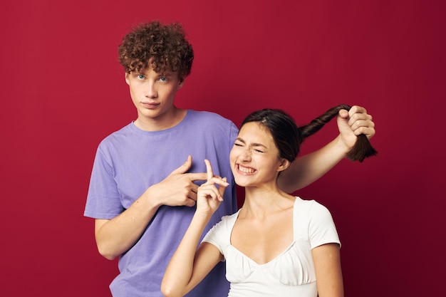 A guy and a girl next to him holding a pigtail emotions