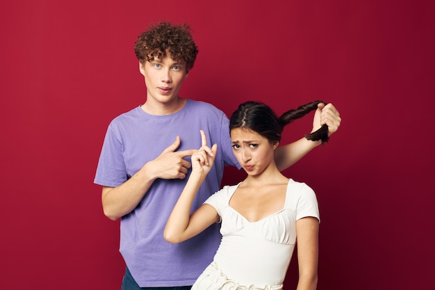 A guy and a girl next to him holding a pigtail emotions