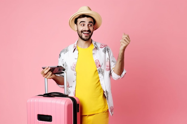 Guy holding his luggage and phone ready for holiday and vacation