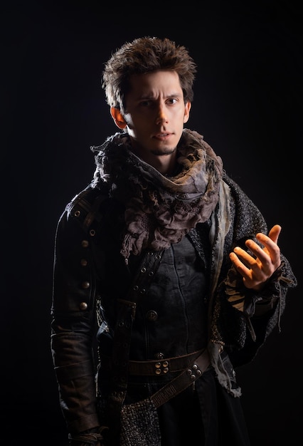 A guy in a steampunk or postapocalyptic image portrait on a black background