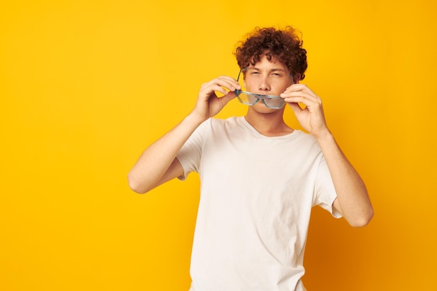 Guy with red curly hair in blue glasses white tshirt fashion modern style isolated background unaltered