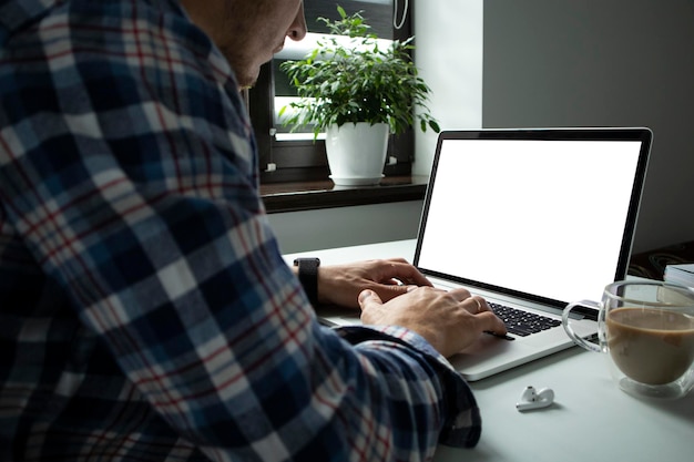 The guy working with laptop online from home