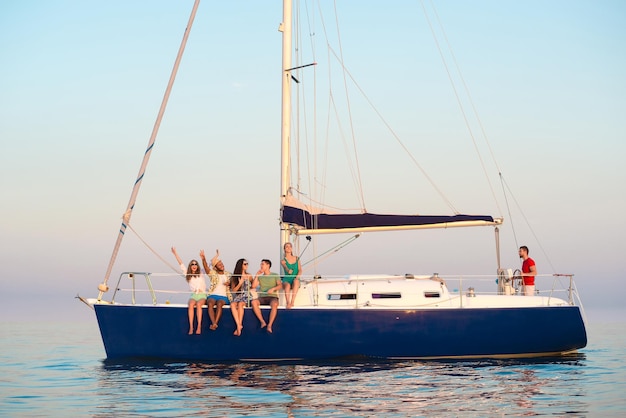 Guys and girls shoot selfie on a yacht