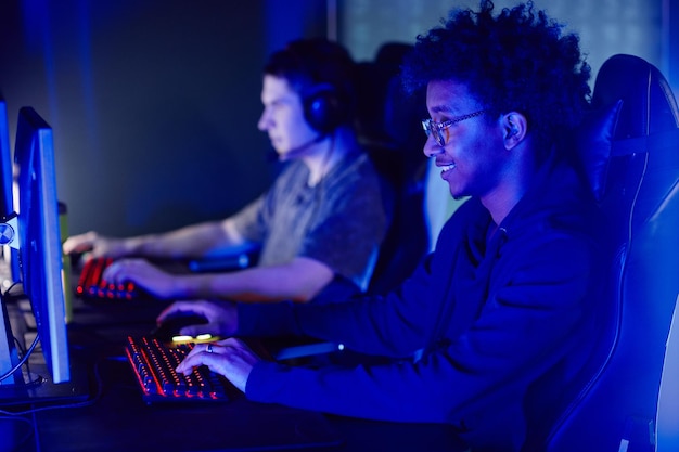 Guys Playing Video Games in Neon Light