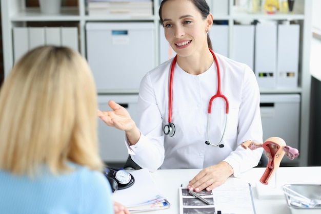 Gynecologist doctor consults woman in clinic diseases of female reproductive system and uterus