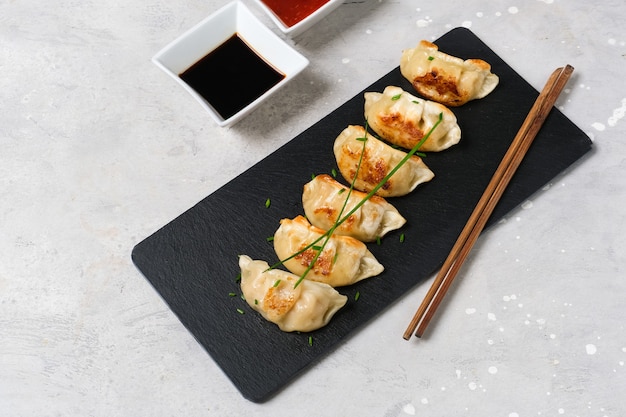 Gyoza Japanese dumplings with soy sauce. Asian cuisine. typical food Japanese Chinese Korean. delivery takeaway