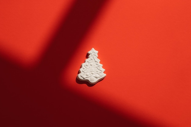 Gypsum figure of a Christmas tree on a colored background