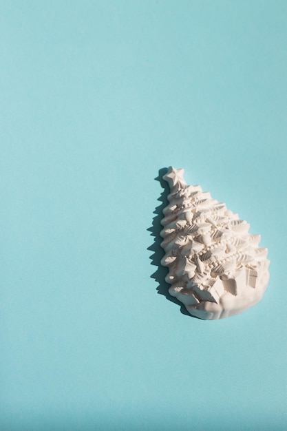 Gypsum figure of a Christmas tree on a colored background