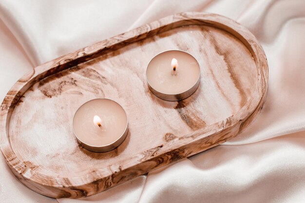 Gypsum marble decorative stand with candles on the background of silk stand