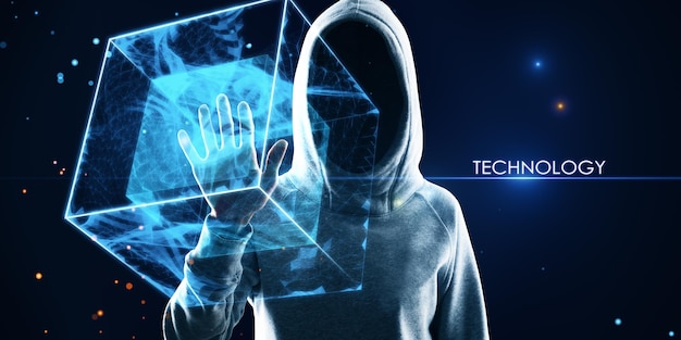 Hacker in hoodie using creative square polygonal technology hologram on blurry background Geometry hacking big data and tech concept