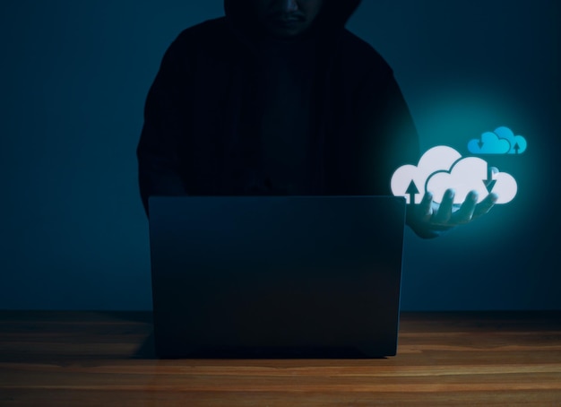 Hackers work on laptops in the dark Concepts of information security systems in the Internet network and information espionage Cloud computing