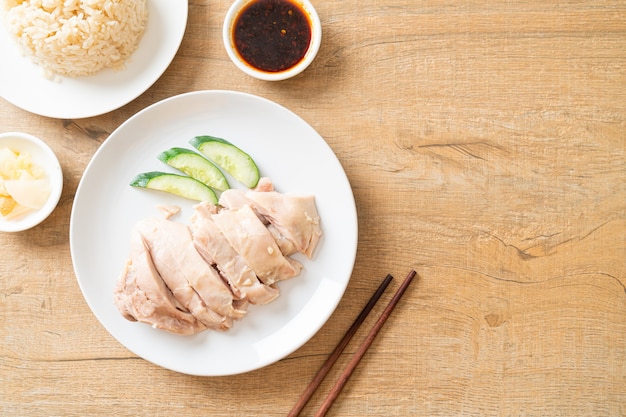 Hainanese chicken rice or rice steamed with chicken soup - Asian food style