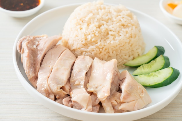 Hainanese chicken rice or rice steamed with chicken soup - Asian food style