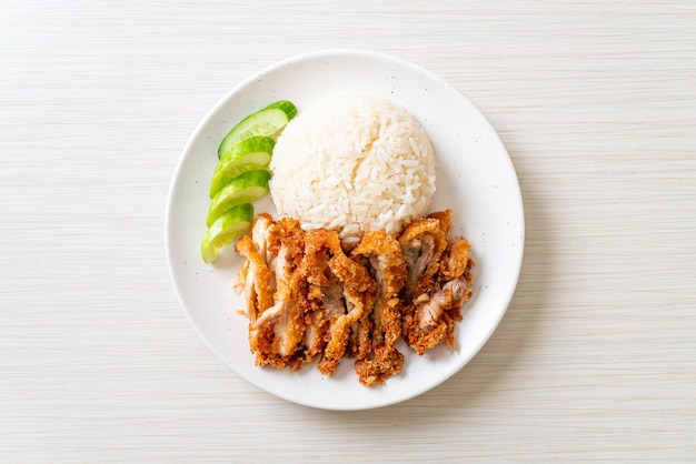 Hainanese chicken rice with fried chicken or rice steamed chicken soup with fried chicken - Asian food style