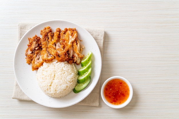 Hainanese chicken rice with fried chicken or rice steamed chicken soup with fried chicken